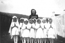 031: Cede McCarthy with First Communion group. l-r Mary Reddy, Vince Carroll, Mary Ennis, Teresa Norman, Kathleen  Barry, Mary Finn (center), Betty Whelan, Madonna McCarthy, unknown, Noreen Ryan. (circa 1946)  - Mary daughter of Michael Reddy &amp;amp; Elizabeth Moore; Vince son of Michael Carroll &amp;amp;  Josie Barry; Mary daughter of Vincent Ennis &amp;amp; Min Carroll; Teresa daughter of Peter Norman  &amp;amp; Marg Norman; Kathleen daughter of Thomas Barry &amp;amp; Anne Dollimont; Mary daughter of  Patrick Finn &amp;amp; Lena Hayward; Betty daughter of William Whelan &amp;amp; Mary Bridget Carroll;  Madonna daughter of James McCarthy &amp;amp; Mary Ellen Barry; Noreen daughter of Albert Ryan &amp;amp;  Catherine Nolan.